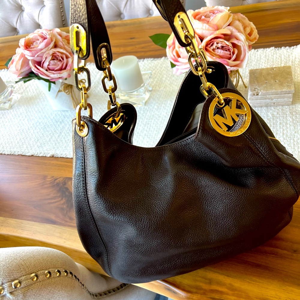 Michael Kors handbag with gold emblem. All leather, supple feel.